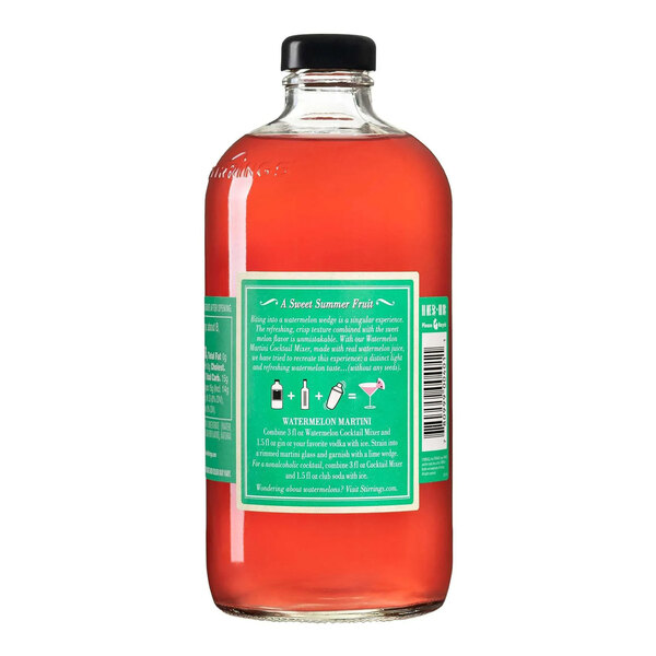 A clear glass bottle filled with pink Stirrings Watermelon Cocktail Mix and sealed with a black cap.