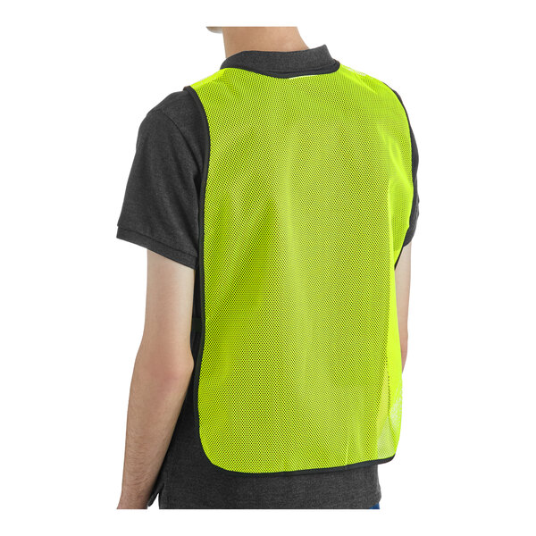 A person wearing a lime high visibility general purpose safety vest.