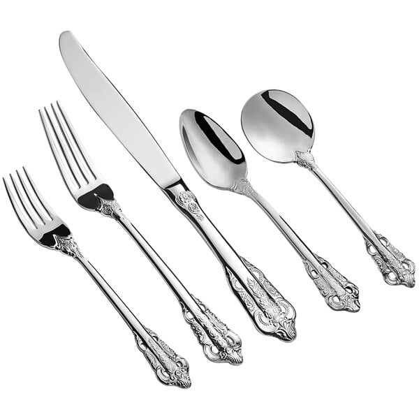 A five-piece set of ornate stainless steel flatware including a dinner fork, salad fork, knife, soup spoon, and teaspoon.