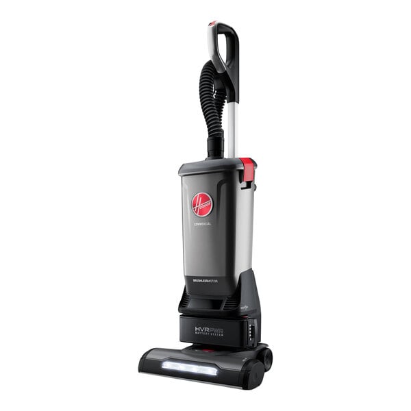A cordless upright vacuum cleaner with cleaning tools and a 40V battery.