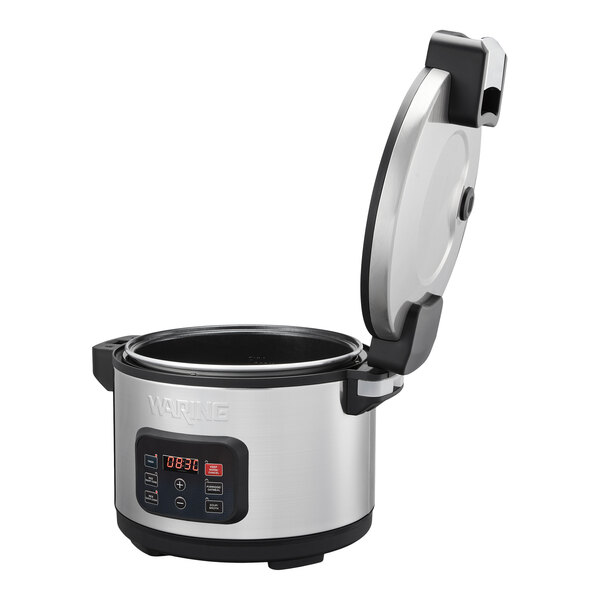 A stainless steel electric rice cooker and warmer with a digital control panel and an open hinged lid.