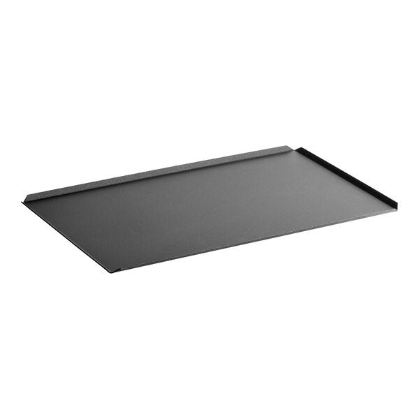 A rectangular non-stick aluminum baking tray with slightly raised edges on two sides.
