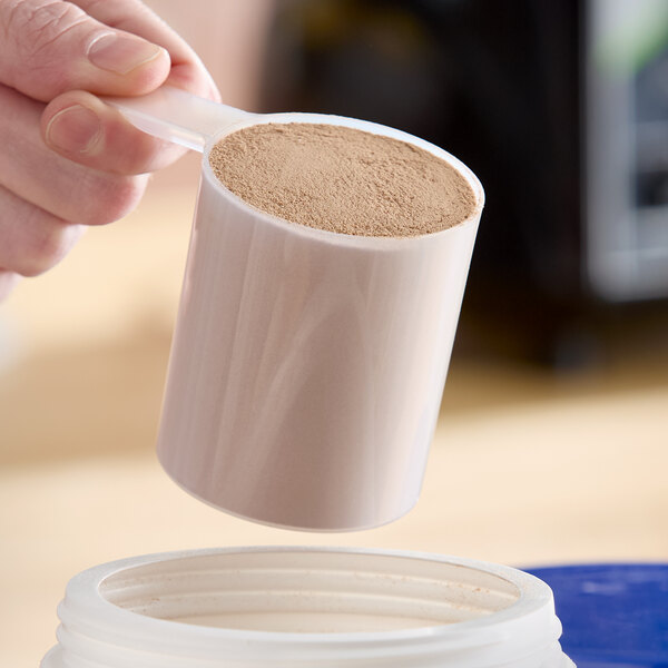 A 7 oz. polypropylene scoop with a short handle filled with powder.
