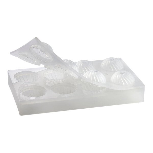 A clear silicone chocolate mold with eight spherical compartments.