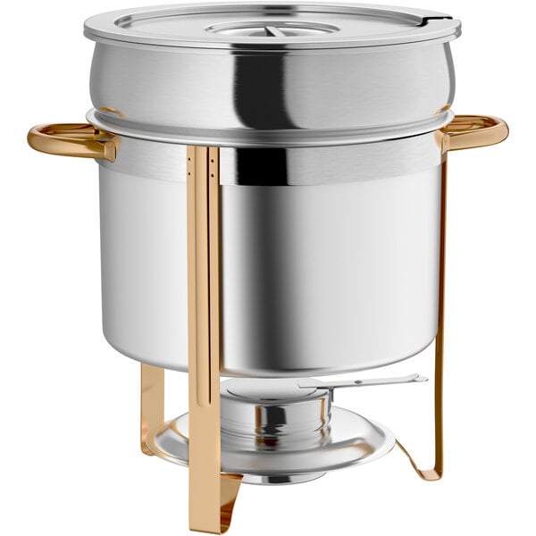 A stainless steel soup chafer with gold accents and a lid.