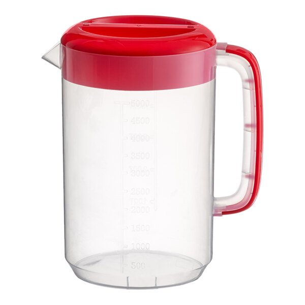 A clear plastic beverage pitcher with a red lid and handle.