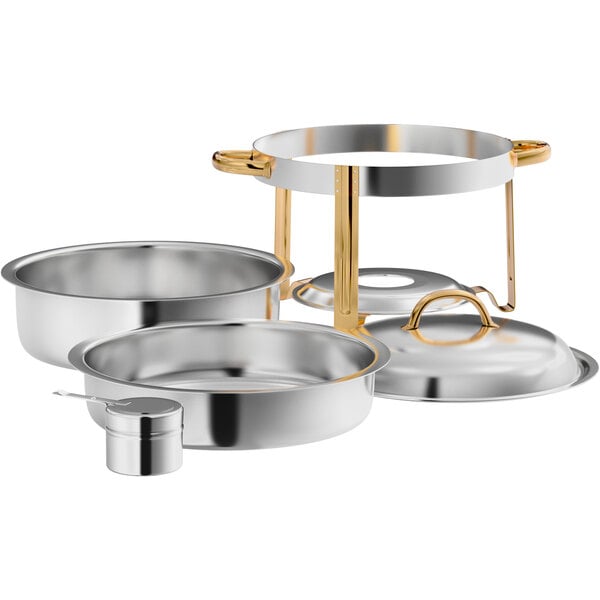 A stainless steel round chafer set with gold accents, including a stand, lid, food pan, water pan, and fuel holder.