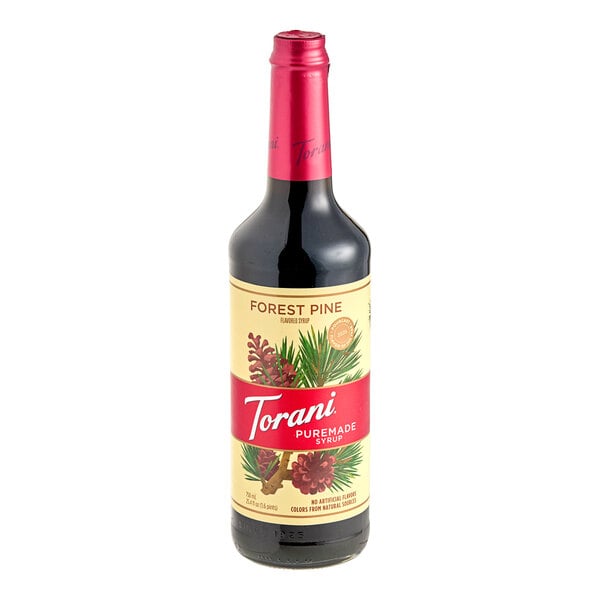 A 750 mL glass bottle of Torani Puremade Forest Pine flavoring syrup.