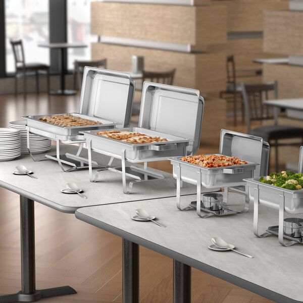 A stainless steel half size chafer used for serving hot food at buffets or events.