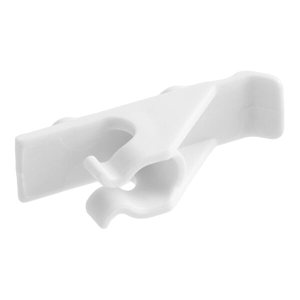 A white plastic clip with a hook-like design, likely intended for attachment to a shelf or similar surface.