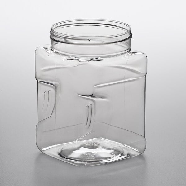 A clear, square 32 oz. PET plastic jar with grip indentations and a wide mouth opening.