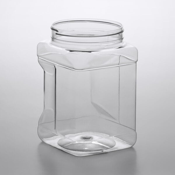 A clear, square 64 oz. PET plastic jar with a grip design and a wide mouth opening.