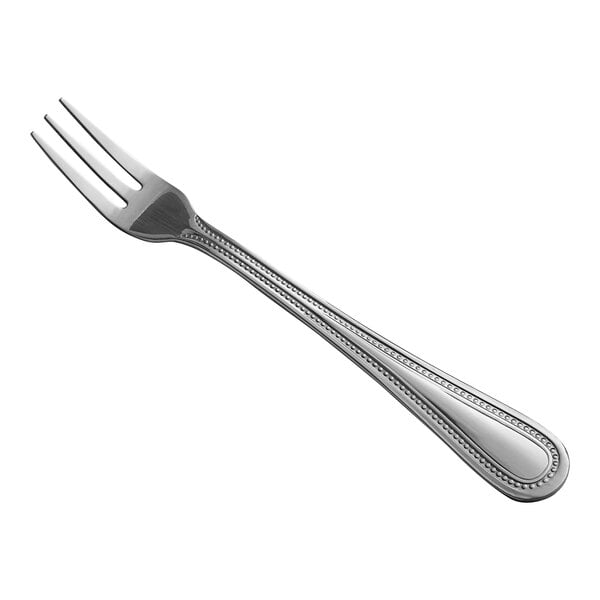 A stainless steel cocktail or oyster fork with a beaded edge design.