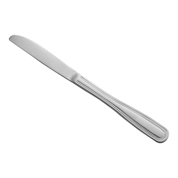 A stainless steel medium weight dinner knife with a simple, lined handle design.