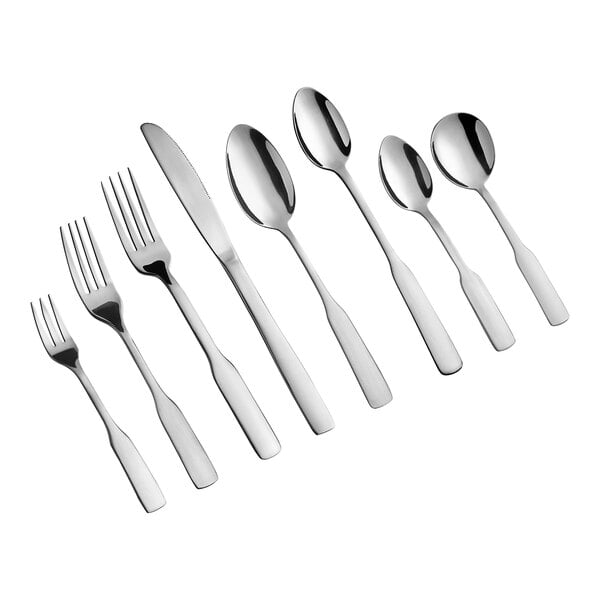 A set of stainless steel flatware including forks, knives, and spoons arranged in a row.