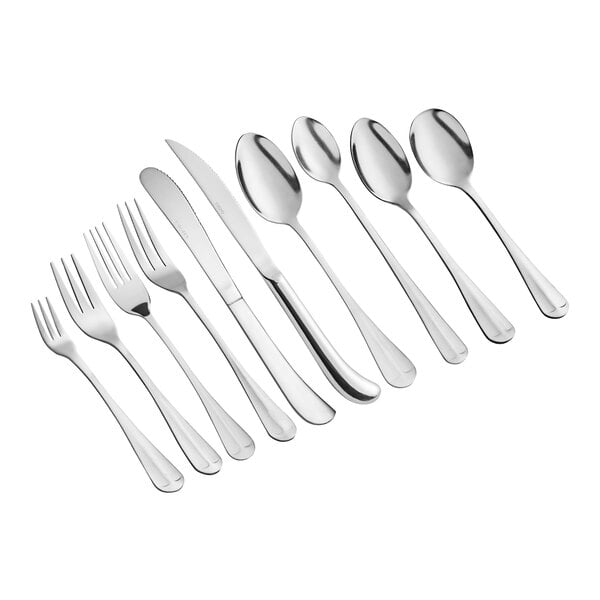 A set of stainless steel flatware including forks, knives, and spoons arranged in a row.