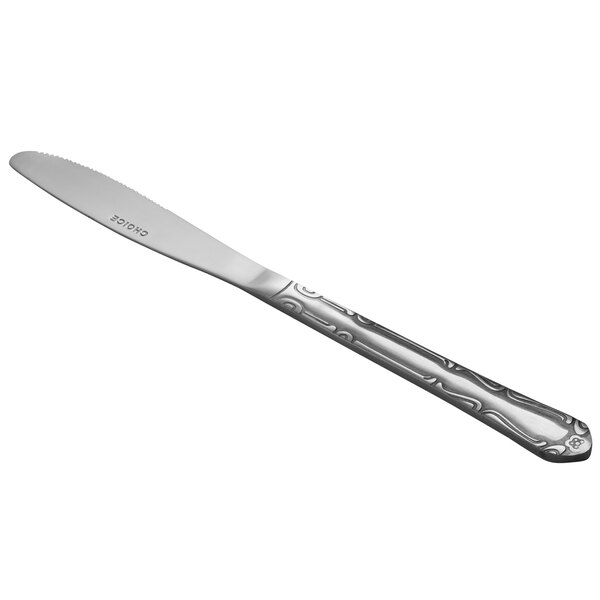 A stainless steel medium weight dinner knife with a decorative handle.