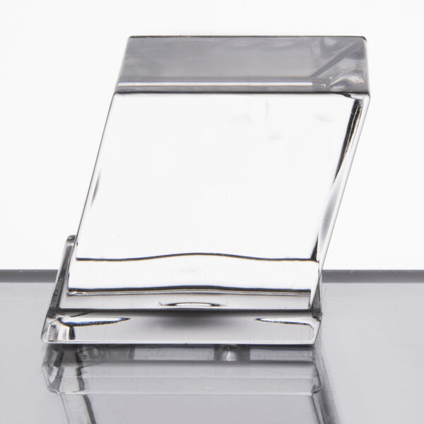A clear, rectangular ice machine component with a slanted design, likely part of a commercial ice maker.