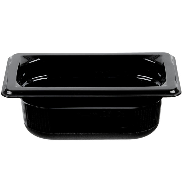 A black Vollrath plastic food pan with a white text label.