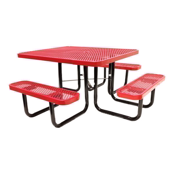 A square red expanded metal picnic table with attached benches and black metal legs.