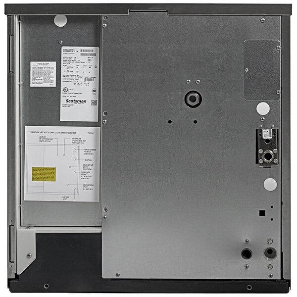 A commercial Scotsman water-cooled medium cube ice machine with a metal back panel and technical labels.