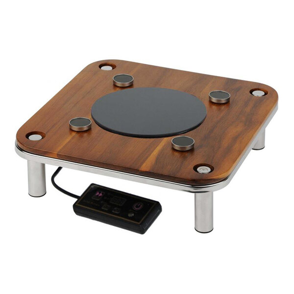 A square natural wood induction warmer with a magnetic platform, metal legs, and an attached digital control panel.