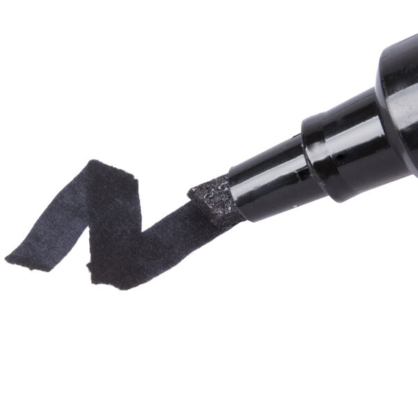 A black chisel tip permanent marker making a thick black line.