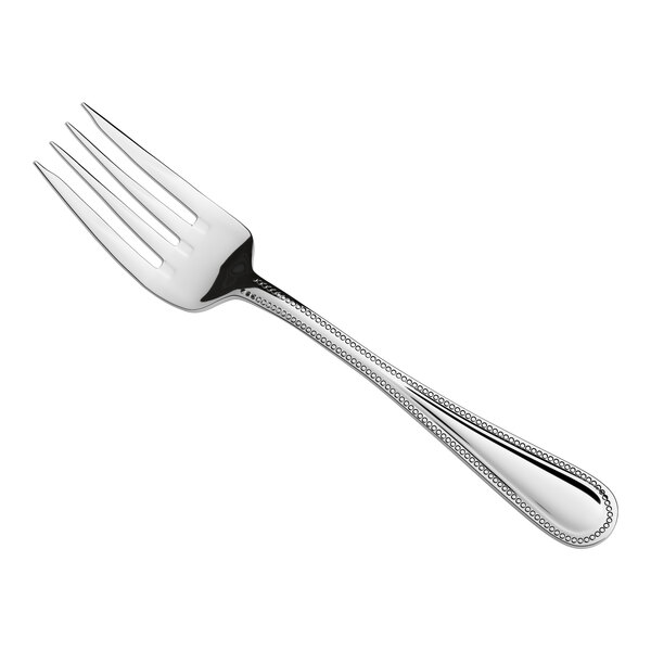 A stainless steel salad or dessert fork with a decorative handle.