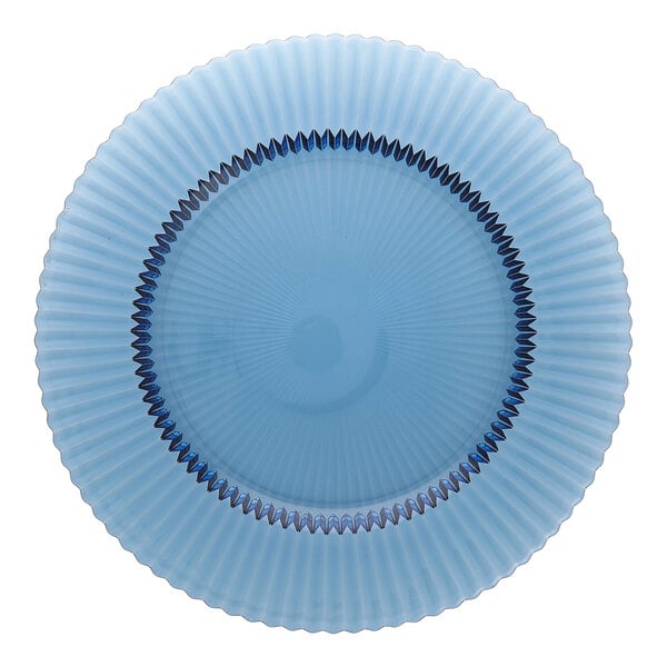 A round cornflower blue glass charger plate with a textured, radiating pattern.