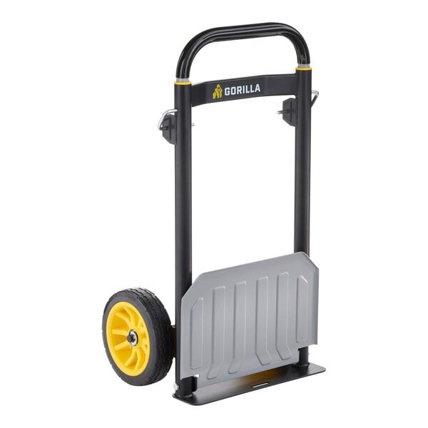 A steel hand truck with a black frame, yellow wheels, and a silver toe plate.