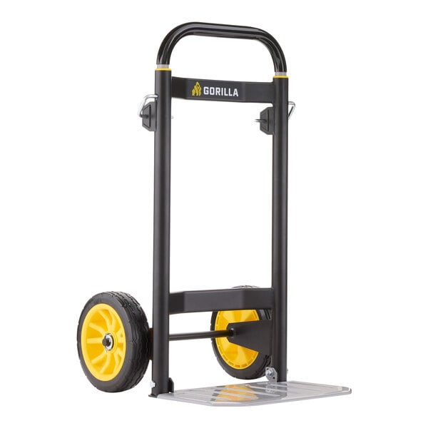 A black and yellow steel hand truck with a metal toe plate and two large wheels.