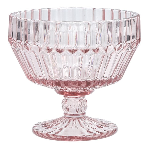 A pink round glass footed dessert bowl with a textured design.