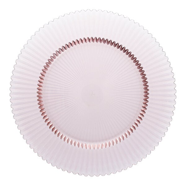 A round pink glass charger plate with a textured, scalloped edge design.