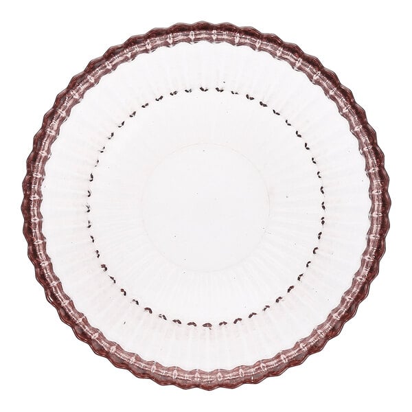 A round pink glass cereal bowl with a scalloped edge.