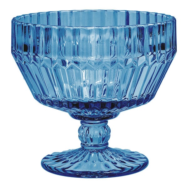 A blue round glass footed dessert bowl with a textured design.