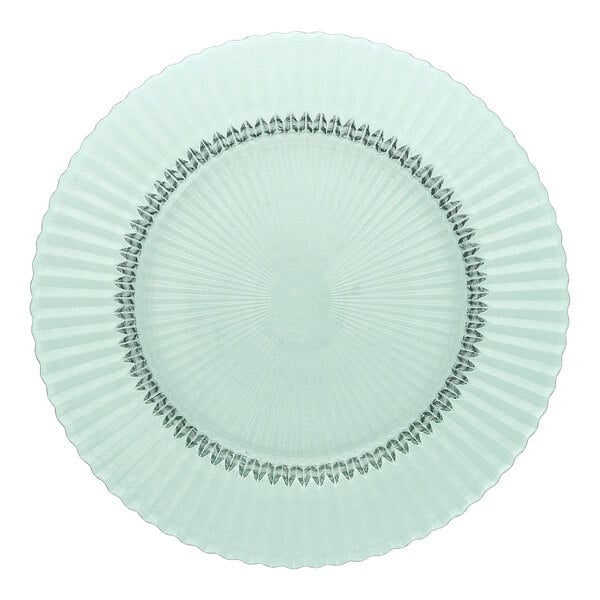 A round, textured glass charger plate in a light green color.