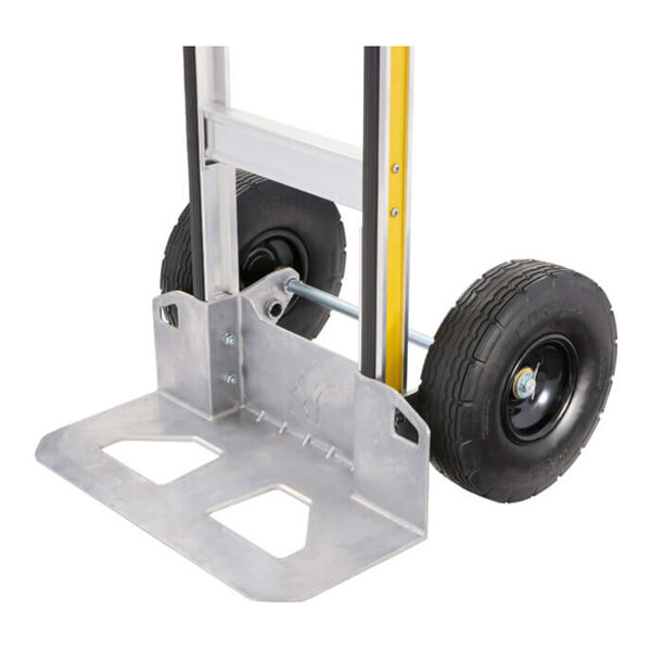A heavy-duty aluminum hand truck with large pneumatic wheels and a wide toe plate.