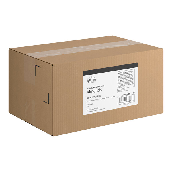A large brown cardboard box with a white label indicating it contains whole raw treated almonds.
