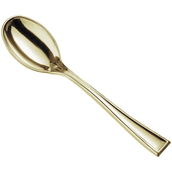 A small gold-colored plastic tasting spoon.