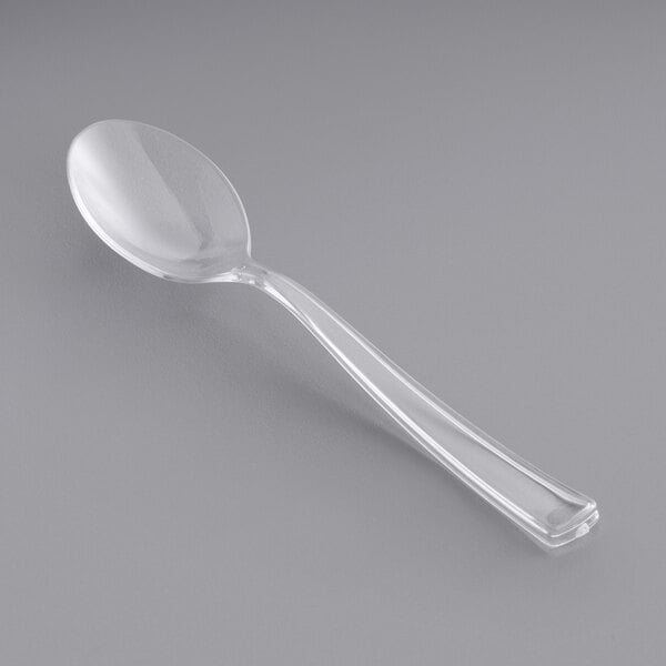A clear plastic petite tasting spoon.