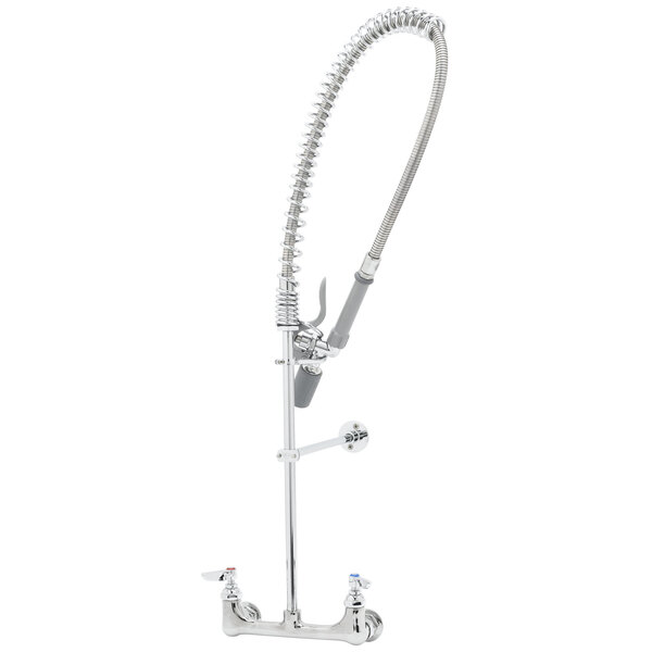 A silver T&S wall mounted pre-rinse faucet with a hose.