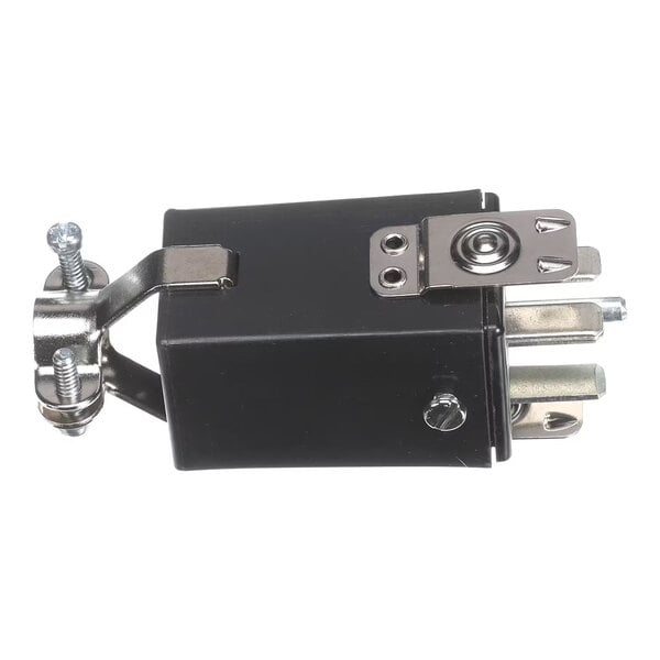 A black electrical plug with metal prongs and mounting hardware.