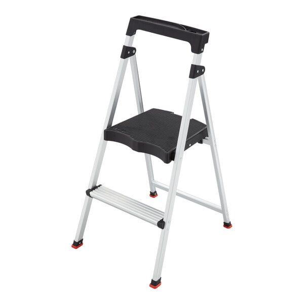 A two-step aluminum folding step stool with a black handle and wide top platform.