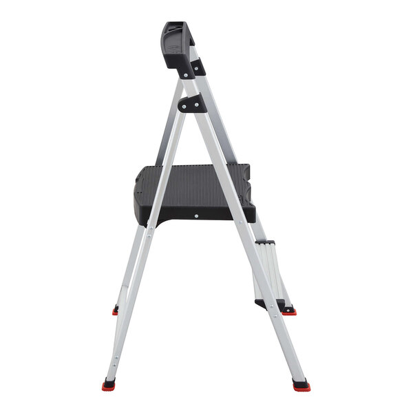 A two-step aluminum folding step stool with a black platform and red-capped feet.