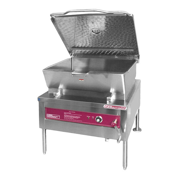 A large stainless steel 40-gallon manual tilt skillet with a red control panel, designed for commercial kitchen use.