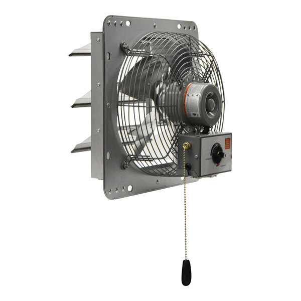 A shutter-mounted wall exhaust fan with a metal frame, protective grill, and pull chain control.