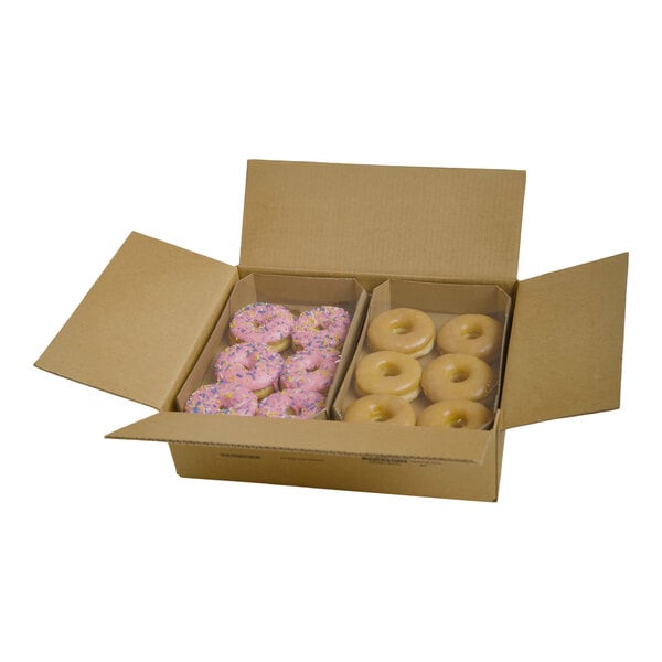 A cardboard box containing an assortment of donuts, including pink frosted donuts with sprinkles and glazed donuts.