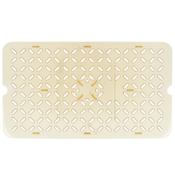 A beige plastic surface with holes.