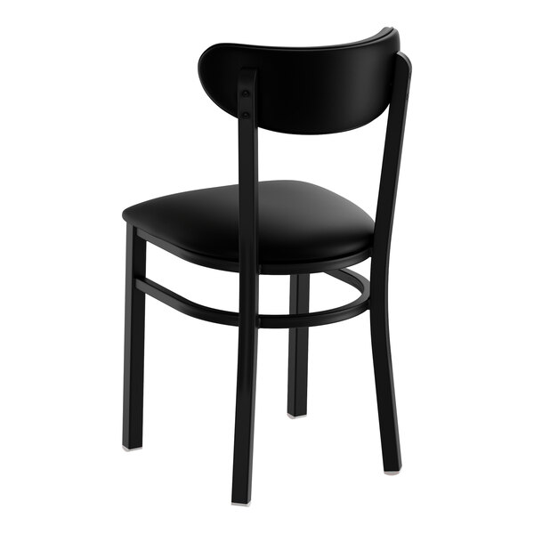 A black metal chair with a black vinyl seat and backrest, shown unassembled.