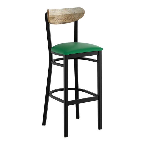 A black metal bar stool with a green vinyl seat and a driftwood-finished wooden backrest.